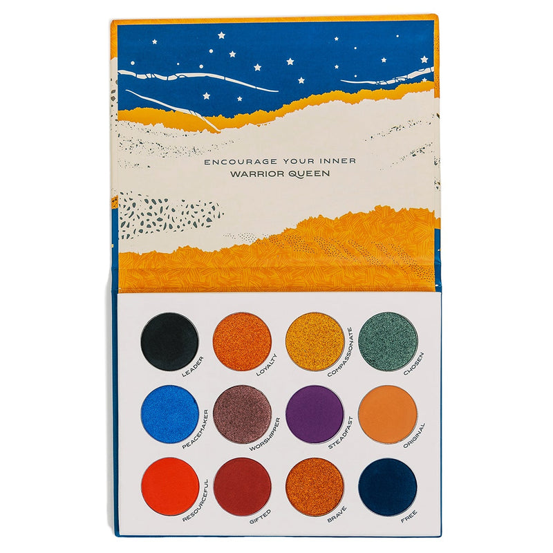 Inside view of In The Beginning eyeshadow palette shows the phrase “encourage your inner warrior queen” and it's 12 colors: Leader, loyalty, compassionate, chosen, peacemaker, worshipper, steadfast, original, resourceful, gifted, brave and free.